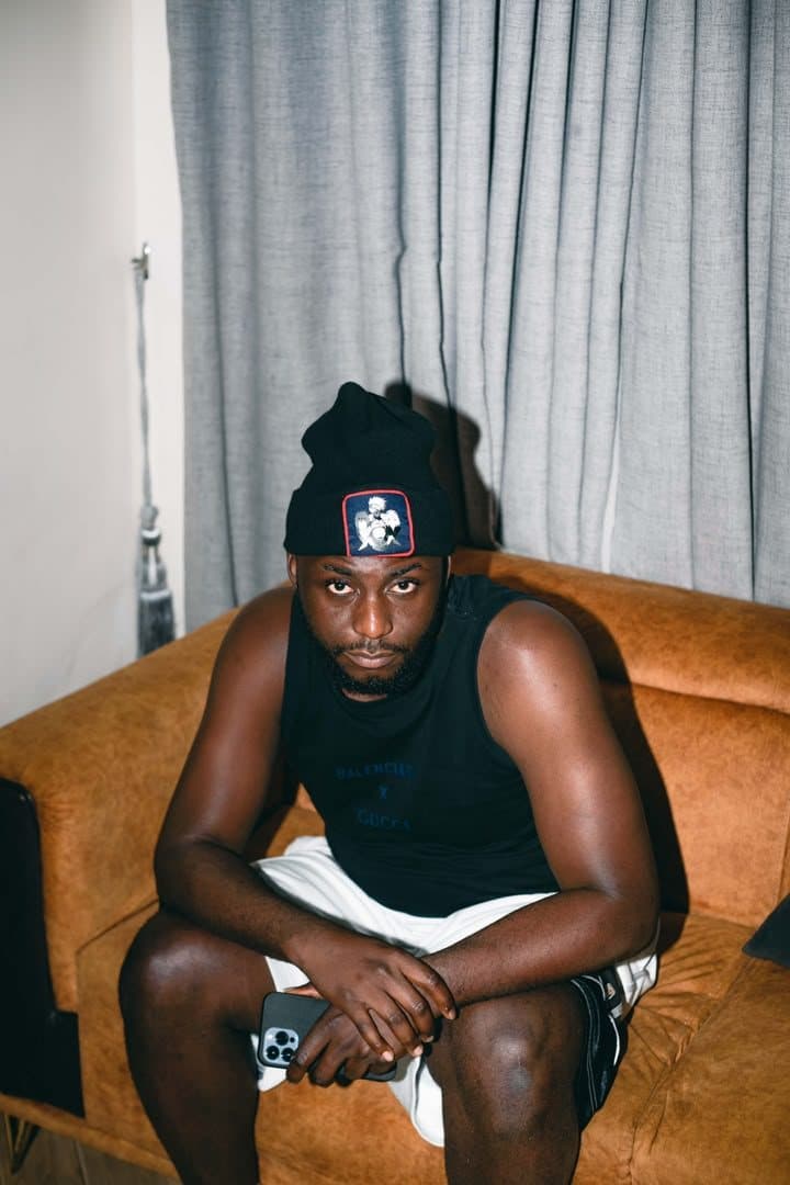 Woriidem in a black beanie, looking into the camera